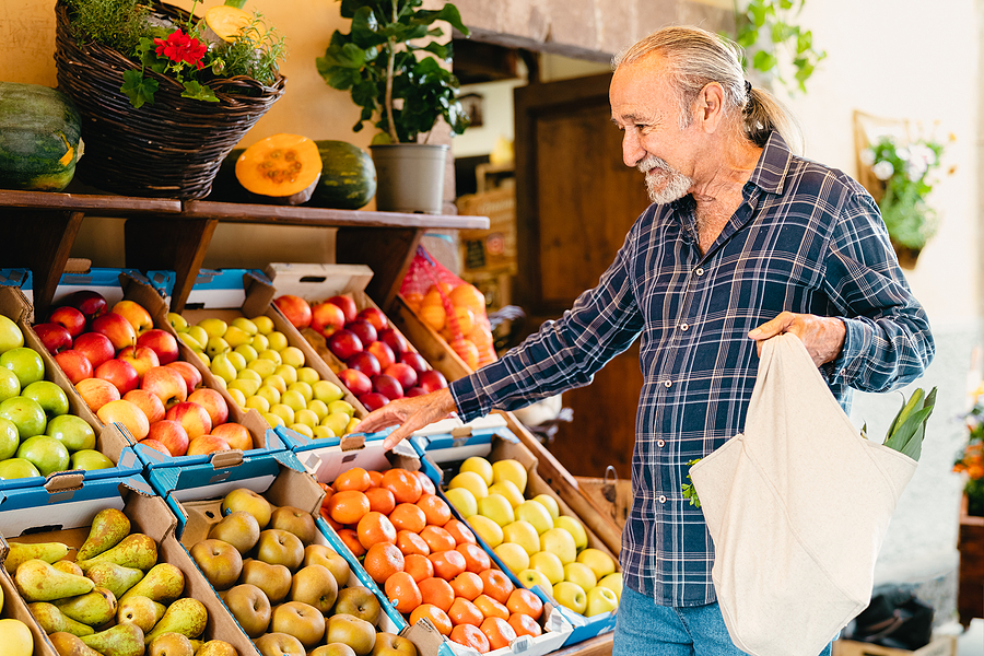 Senior man shopping for fresh fruit and vegetables
